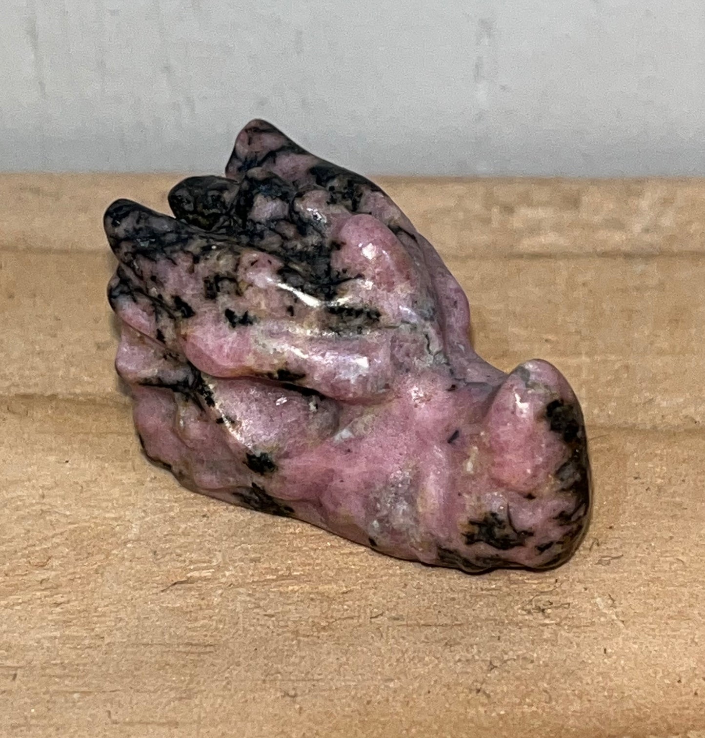 Pink Rhodonite crystal dragon head carving