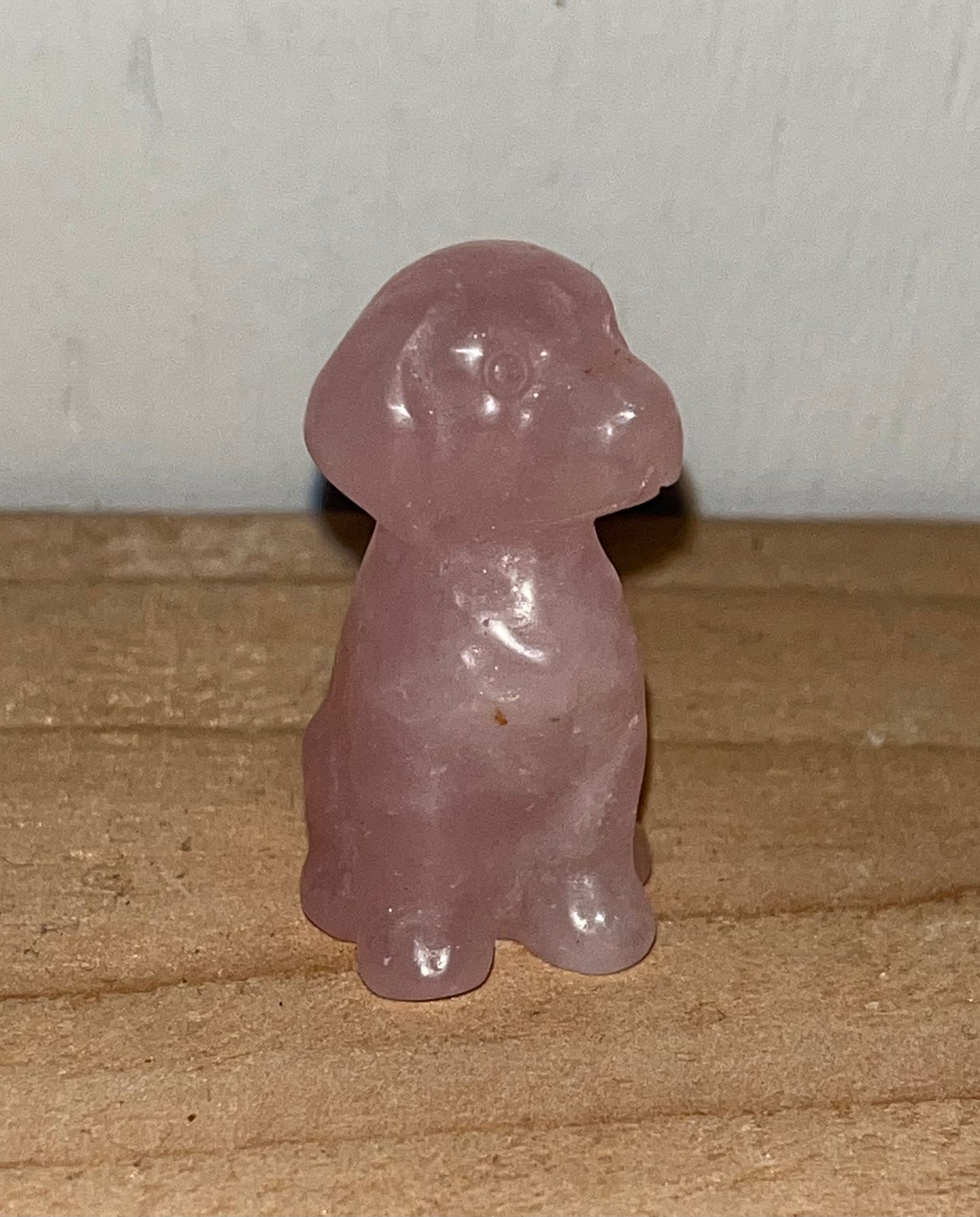 Rose quartz crystal dog carving