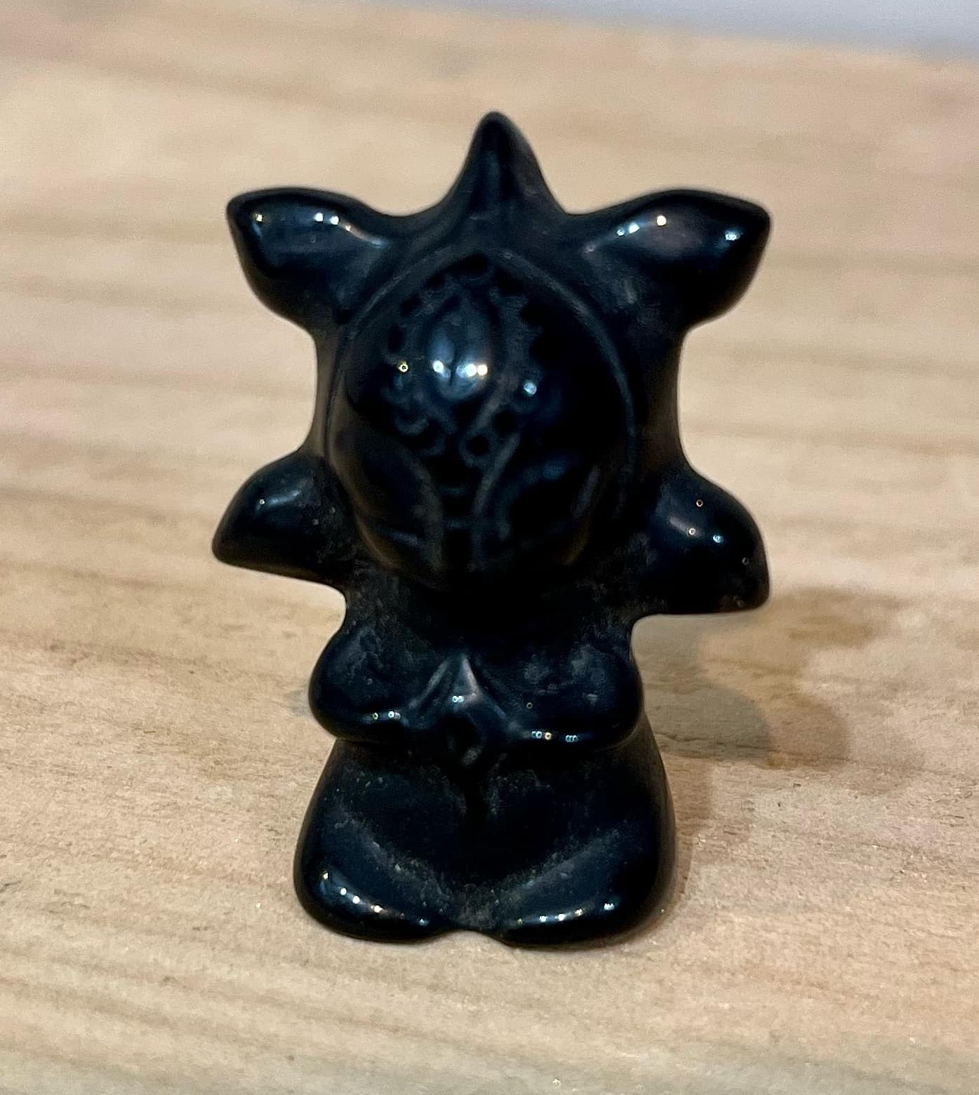 Black obsidian crystal guardian carving