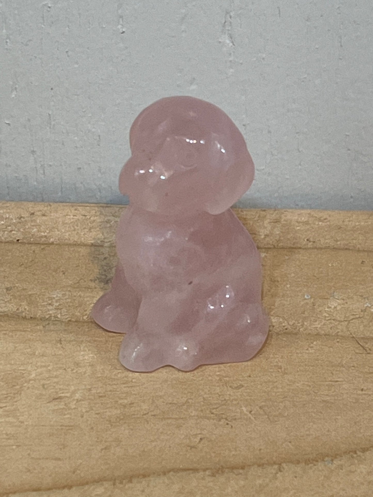 Rose quartz crystal dog carving