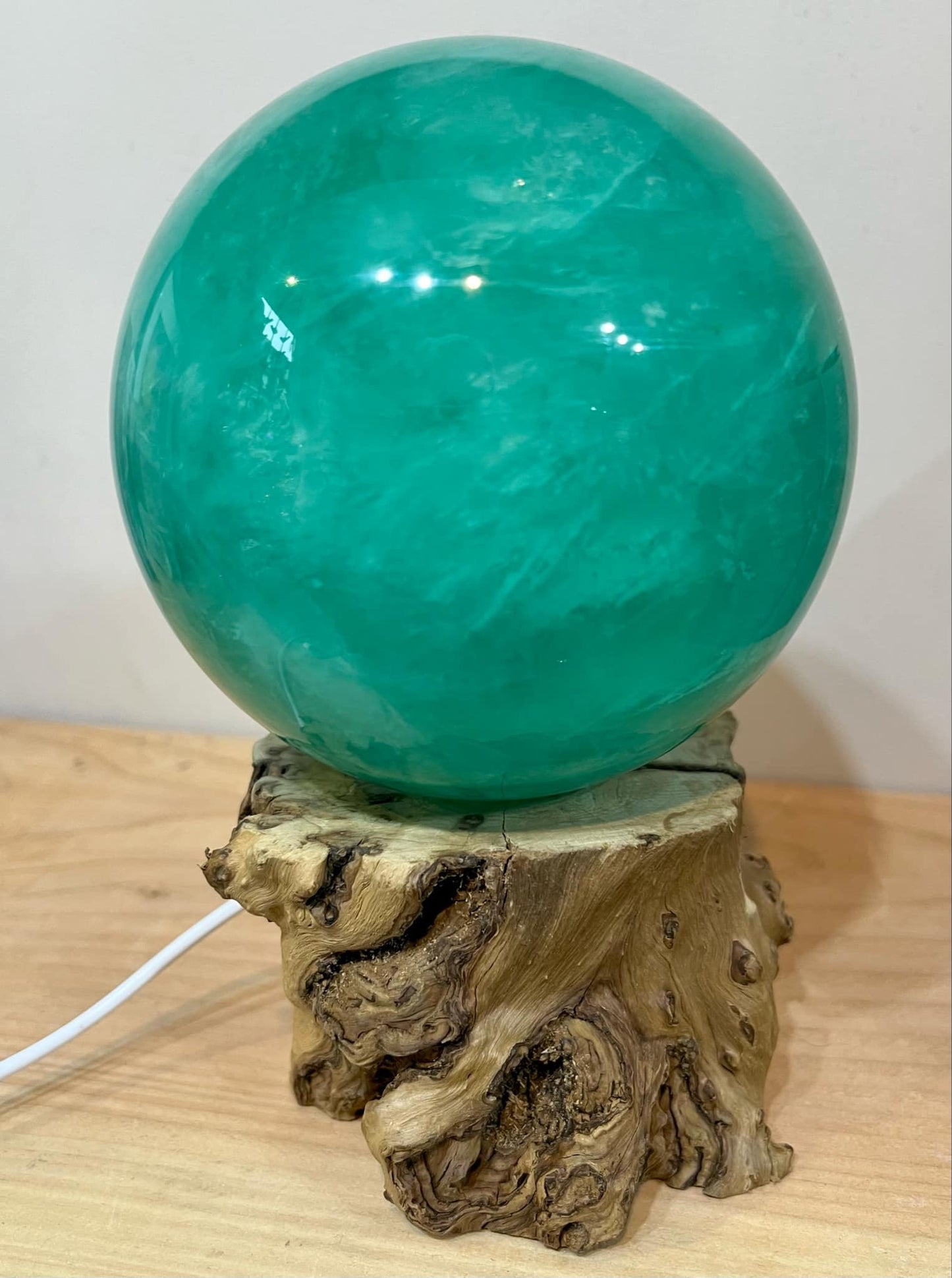 Large green fluorite sphere with wooden light stand 2.2kg